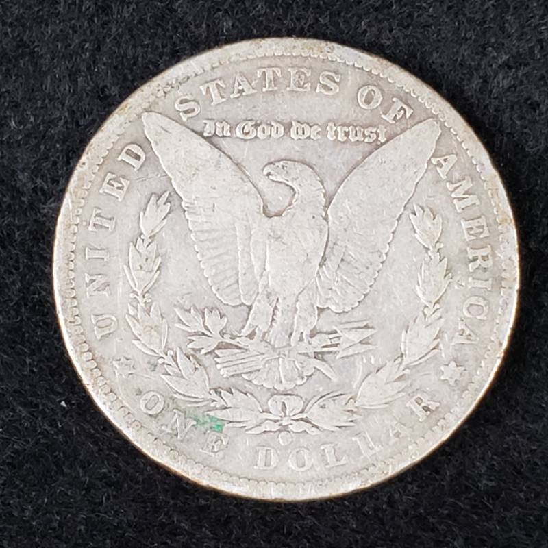 lot 25 image: 1884 O Morgan Silver Dollar