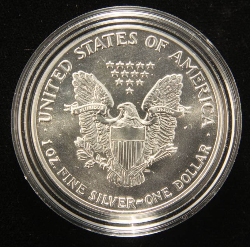 lot 17 image: 1987 AMERICAN SILVER EAGLE 1 TROY OZ. .999 FINE SILVER IN AIRTITE