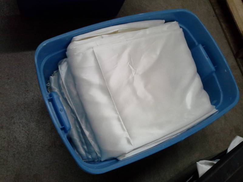 lot 312 image: Lot of (100) Ivory Satin Universal Chair Covers