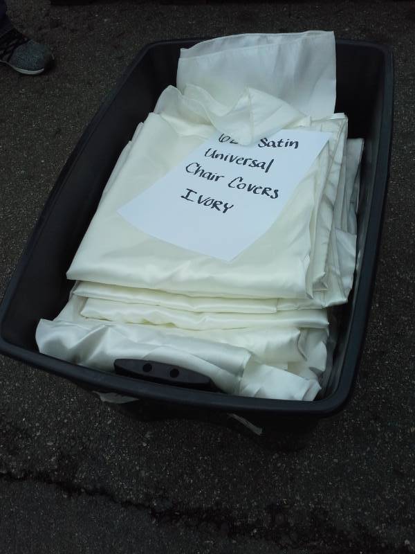 lot 247 image: Lot of (62) Ivory Satin Universal Chair Covers