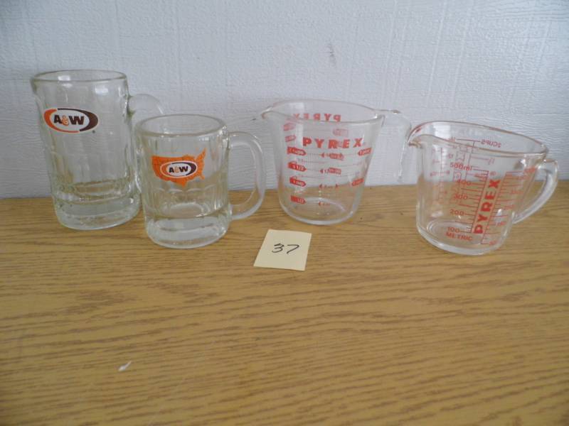 lot 37 image: A&W Mugs - Pyrex Measuring Cups