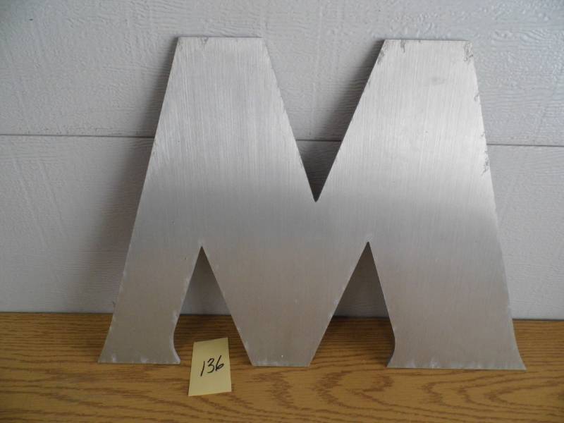 lot 136 image: Aluminum Letter M