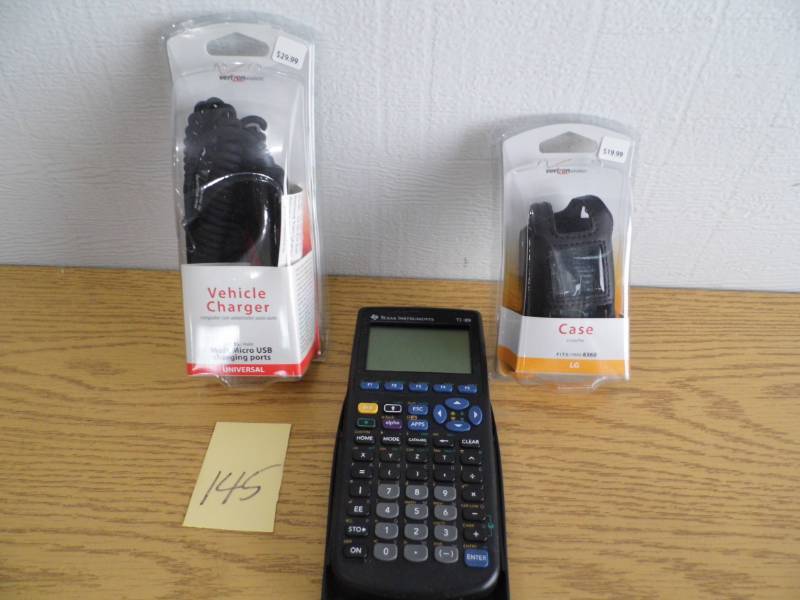 lot 145 image: Phone Charger - Case - Calculator