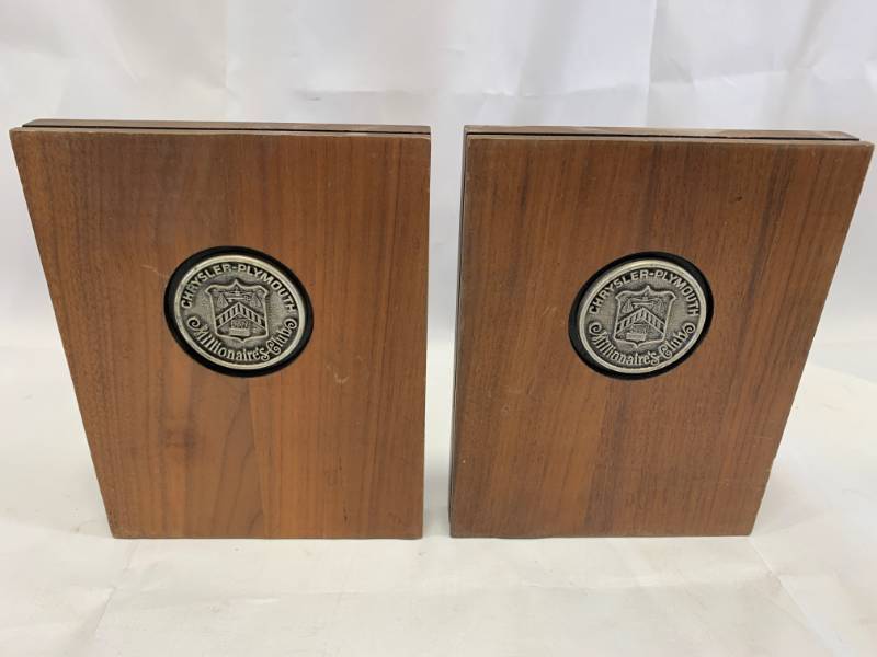 lot 34 image: Chrysler Plymouth Millionaire Clue Bookends