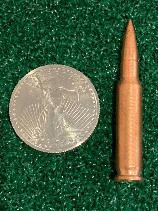 lot 75 image: One Ounce (1oz) Titanium Liberty & .999 Copper .223 Shell