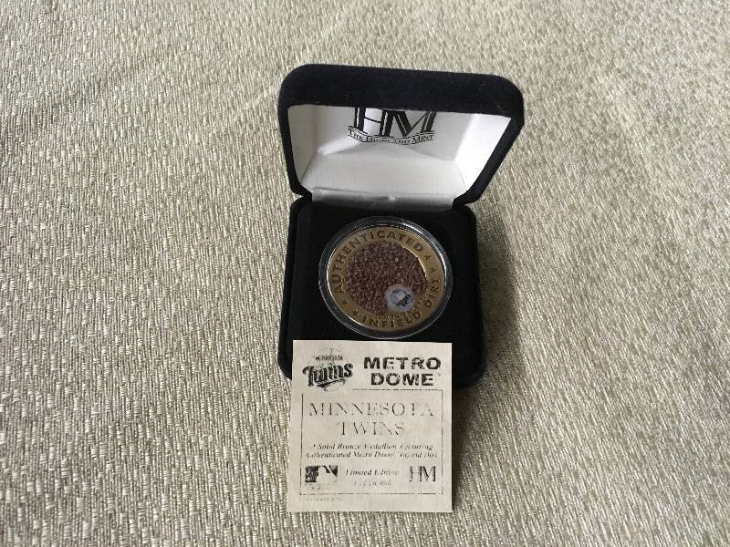 lot 182 image: Minnesota Twins Metrodome Bronze Medallion Featuring Metrodome Infield Dirt
