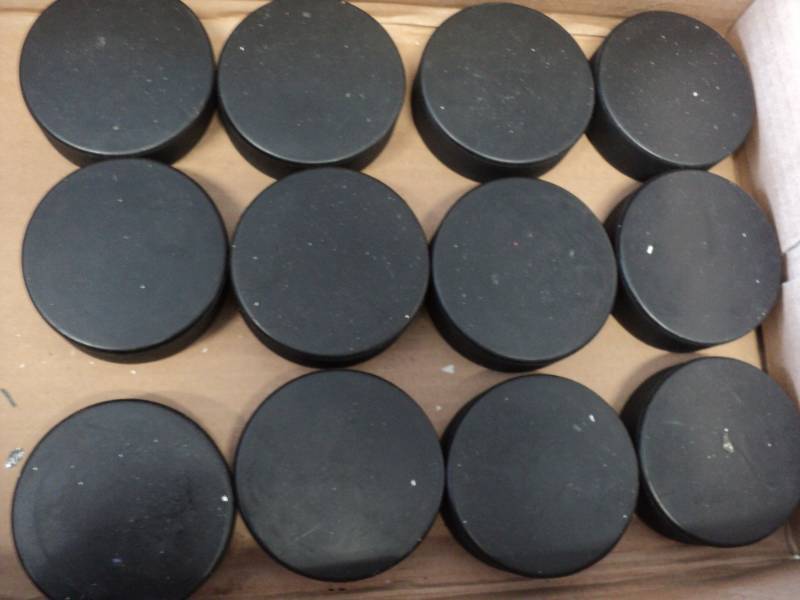 lot 136 image: 12  Pucks...