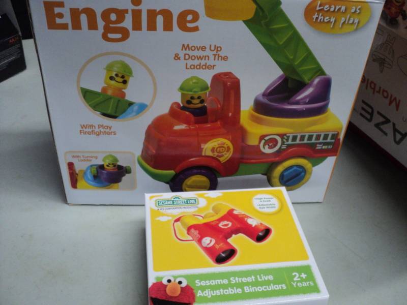 lot 182 image: Fire Engine and Sesame Street binoc...