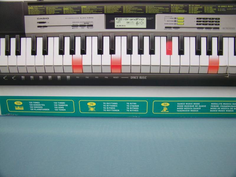 lot 14 image: Casio, LK-135, Electronic Keyboard and Stand - NEW in Original Boxes
