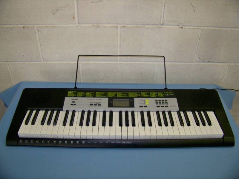lot 15 image: Casio, LK-135, Electronic Keyboard and Stand in Original Boxes