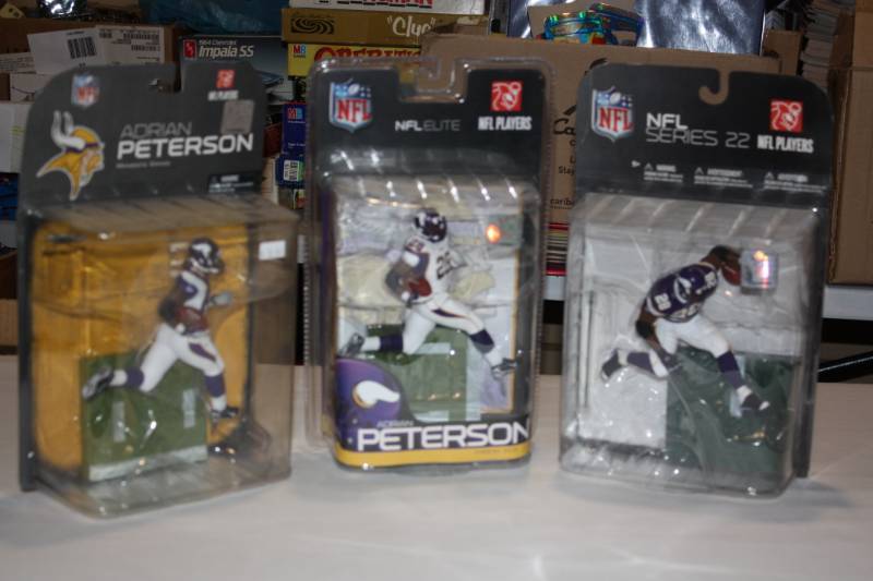 lot 86 image: Lot of 3 Different Adrian Peterson McFarlane Figures