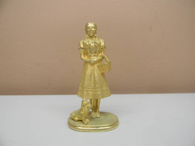 lot 6 image: Wizard of Oz, DOROTHY & TOTO THE DOG, 1989 Carver E. Tripp, 1989 TURNER LED FILLED GOLD TONE FIGURE - 4 TALL - NICE - SEE PICTURES