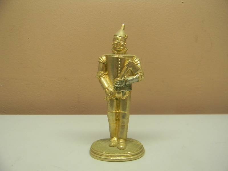 lot 8 image: Wizard of Oz, TIN MAN, 1989 Carver E. Tripp, 1989 TURNER LED FILLED GOLD TONE FIGURE - 4 TALL - NICE - SEE PICTURES