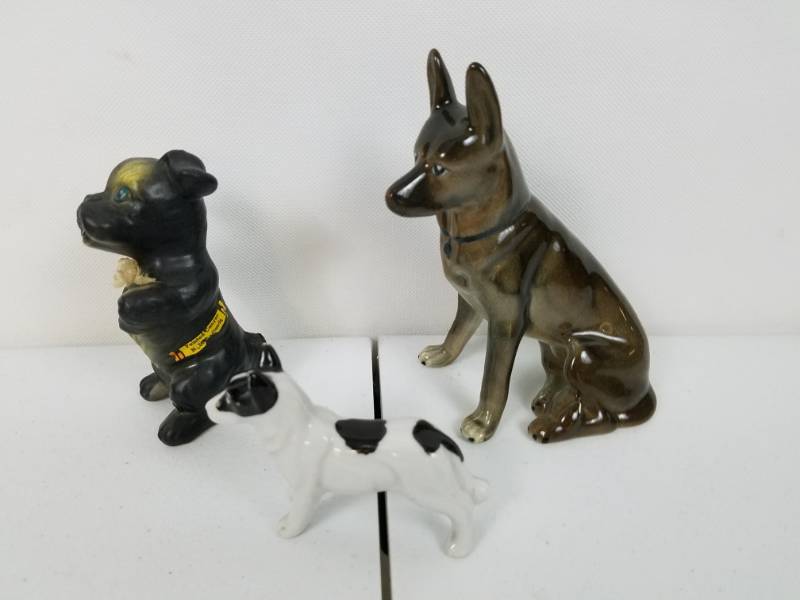 lot 73 image: Lot of three porcelain dogs statues