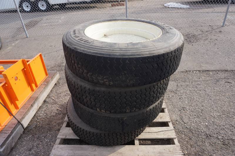 lot 10 image: Firestone T575 LP Radial 22.5 Skid Loader Tires and Rims