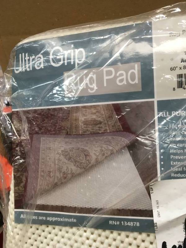 lot 9 image: Tayse Rugs Ultra Grip Gray 5 ft. x 7 ft. Rug Pad in good condition