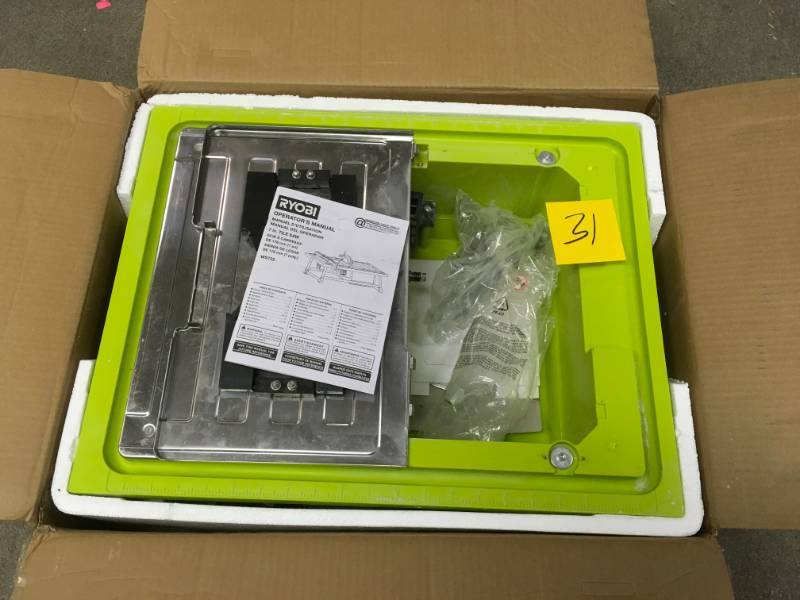 lot 31 image: RYOBI 7 in. 4.8 Amp Tabletop Tile Saw in good condition