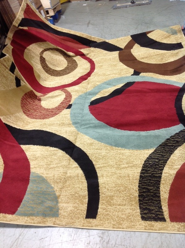 Ottomanson Contemporary Abstract Beige 8 ft. x 10 ft. Area Rug in good condition stain on back side see pictures