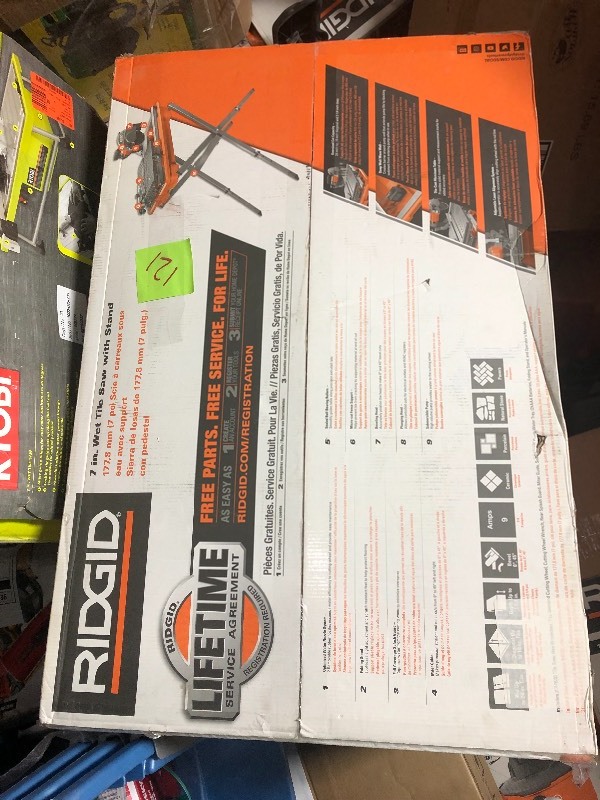 lot 121 image: Ridgid  7 in. Tile Saw with Stand USED  in good condition