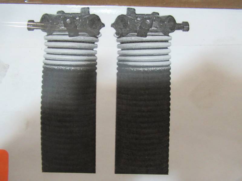 lot 157 image: Dura-lift 0.207 in. Wire x 2 in. D x 23 in. L Torsion Springs in Yellow Left and Right Wound Pair for Sectional Garage Doors