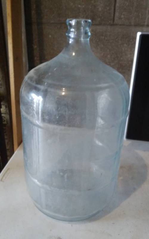 lot 24 image: 5 Gallon Water Bottles Car Boy, Marked Crisa Nets Gallon-Made In Mexico