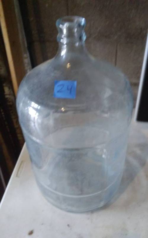 lot 25 image: 5 Gallon Water Bottles Car Boy, Marked Crisa Nets Gallon-Made In Mexico