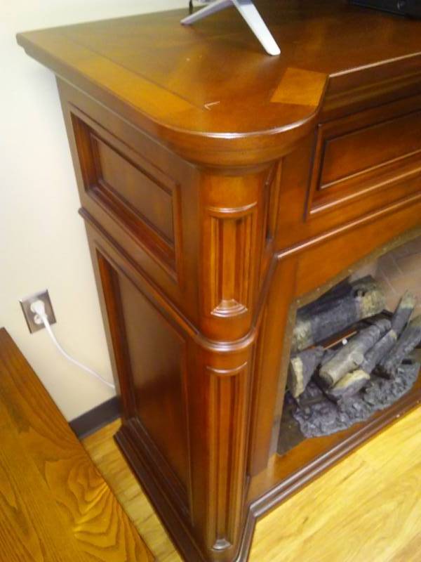 lot 1 image: Electric Fire Place w wood surround. Dimplex with remote.