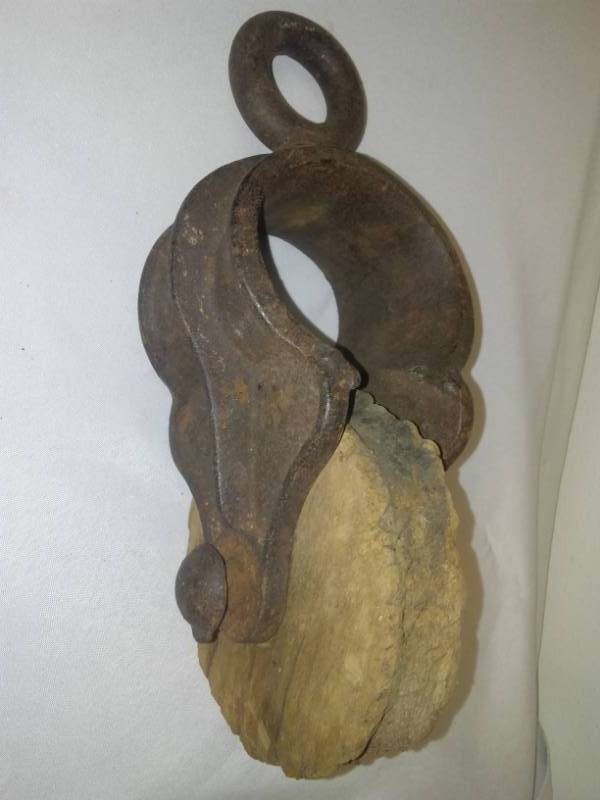 lot 66 image: Cast and wood antique pulley