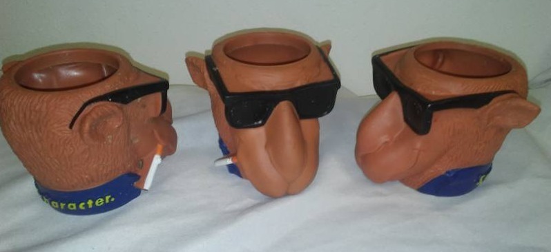 lot 109 image: Tobacciano, Joe Camel can coolers, Joe cool rubber smooth character.