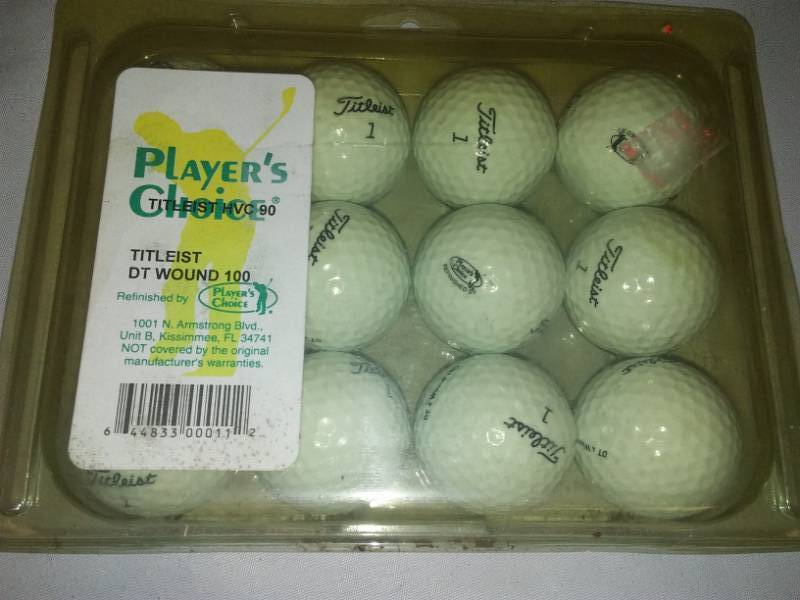 lot 126 image: One dozen Titleist golf balls.