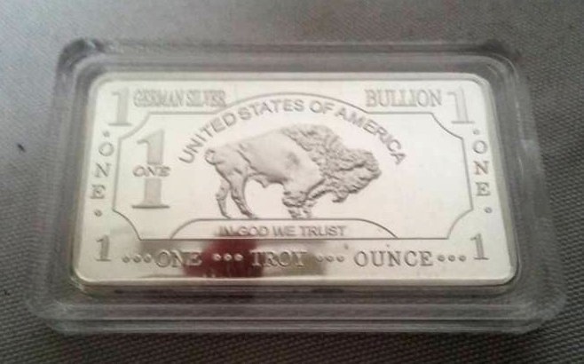 lot 141 image: NDSU Bison German silver 1 oz bar. Great graduation gift