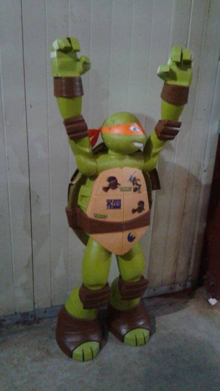 lot 15 image: 4 Foot Teenage Mutant Ninja Turtle Figure, Used, Shows Wear, Back Has Dent On It