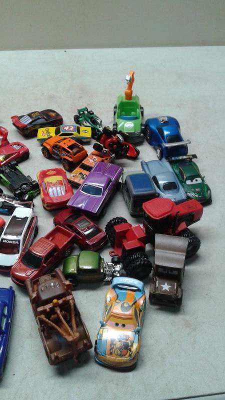lot 64 image: Bucket With Some Toy Model Cars, New John Deere Toy