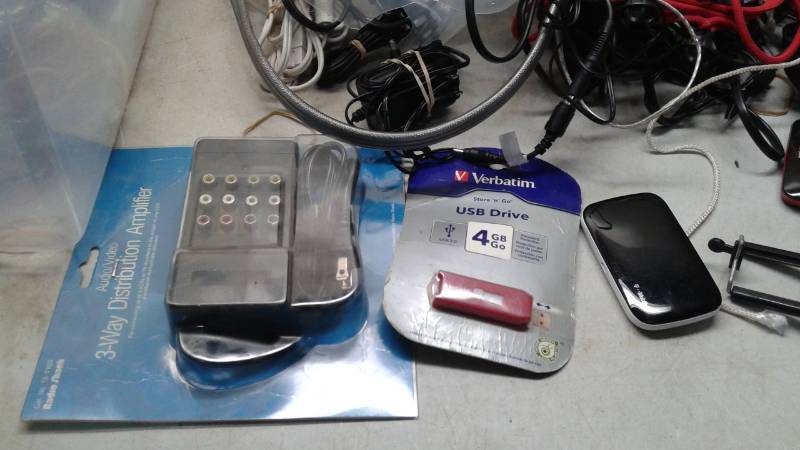 lot 96 image: Bin Filled With Mixed Electronic Wires, Cords, Selfie Stick