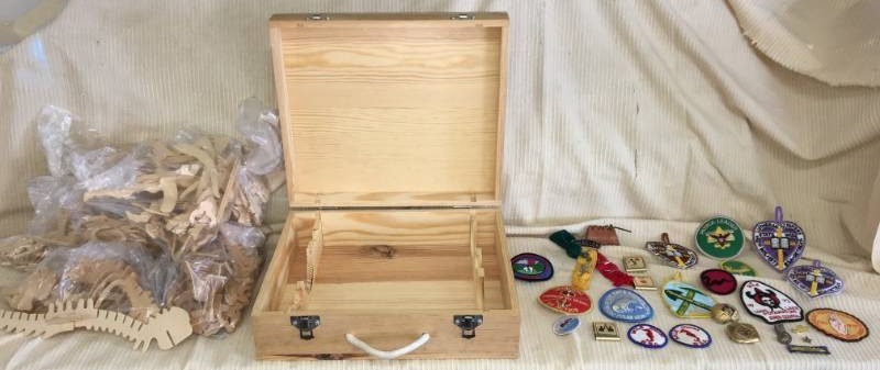 lot 54 image: Vintage Boy Scout Patches, Dinosaur Bone Figures, and Wine Box