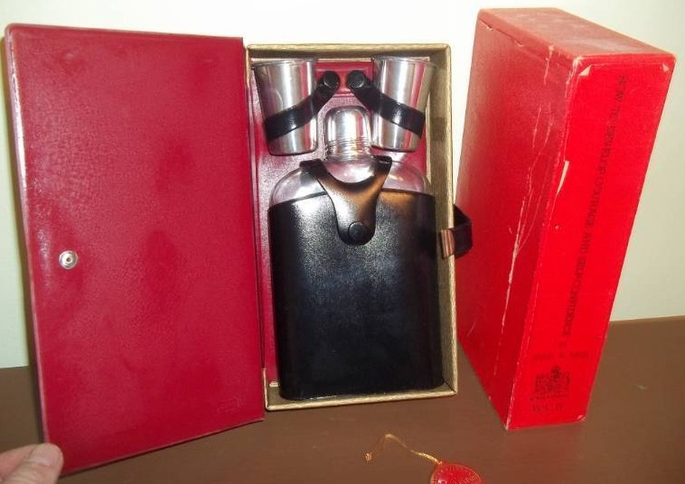 lot 125 image: Flask and Shot Glasses in a Book
