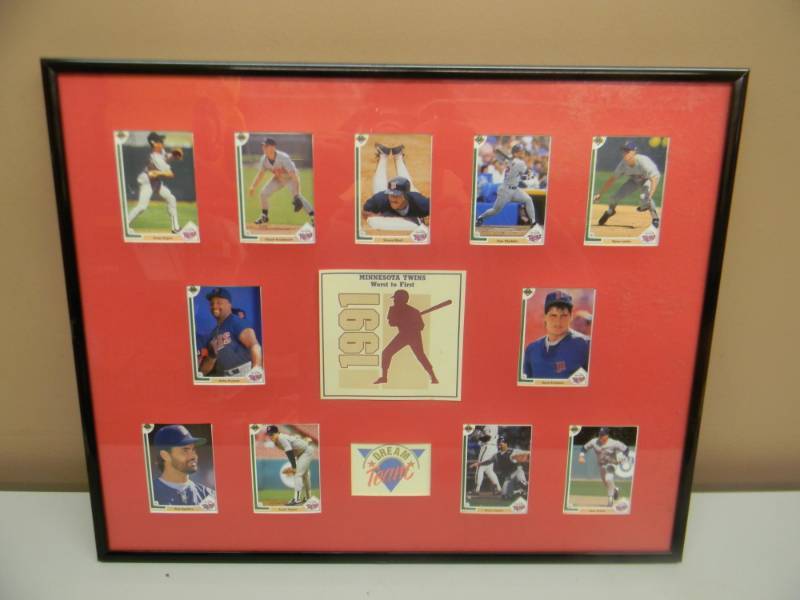 lot 30 image: VINTAGE 1991 MINNESOTA TWINS WORLD CHAMPIONS FRAMED CARD DISPLAY - APPROX 21 BY 16 - SEE PICTURES