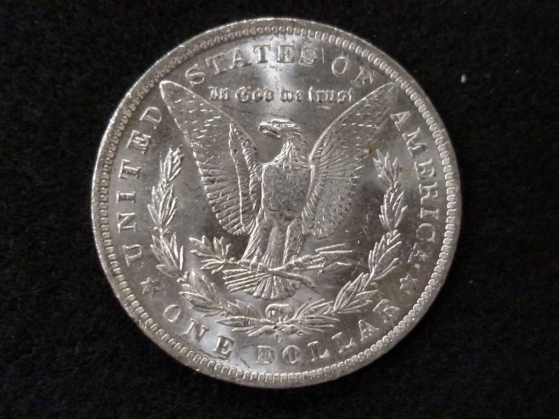 lot 11 image: 1884 O MS Morgan Silver Dollar...