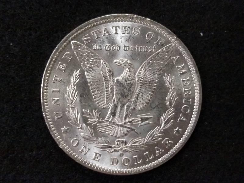 lot 12 image: 1885 O MS Morgan Silver Dollar...