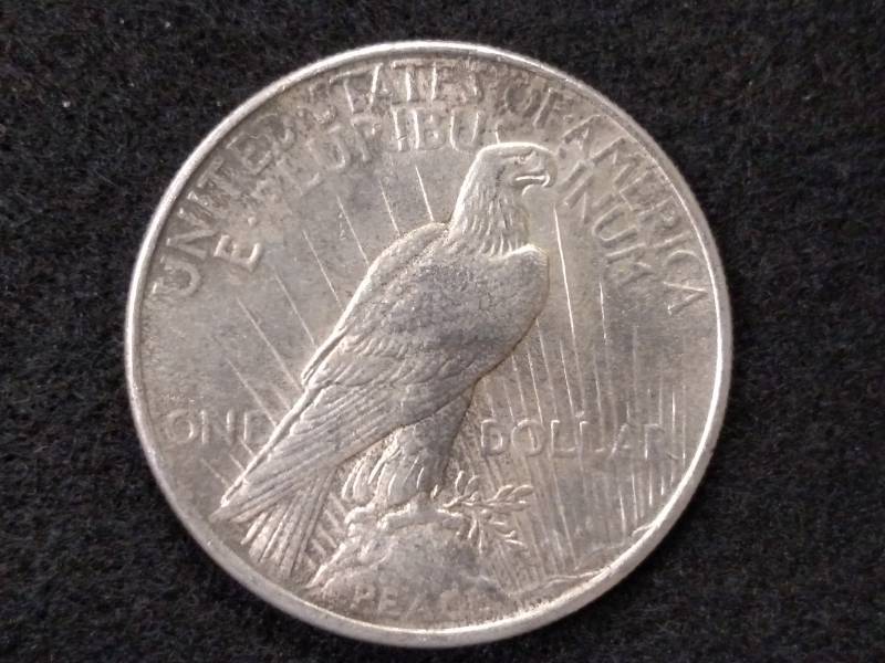 lot 53 image: 1925 Peace Silver Dollar...