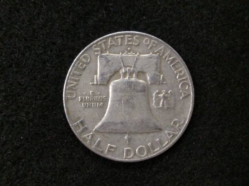 lot 91 image: 1957 D Franklin Silver Half Dollar...