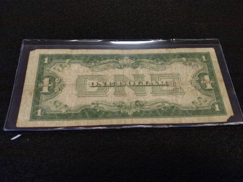 lot 131 image: 1928 A Funny Back One Dollar Silver...