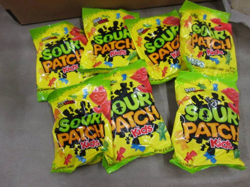 lot 234 image: 7- 8 oz Sour Patch Kids Candy...