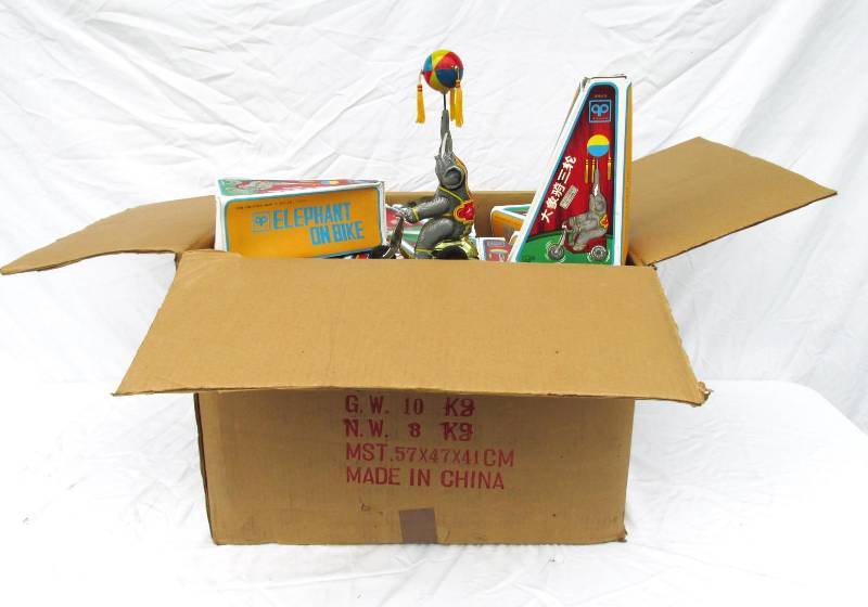 lot 7 image: Large Lot of New Vintage Elephant on Bike Wind Up Tin Toys