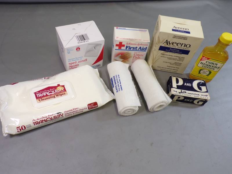 lot 110 image: First Aid, Procter and gamble Naphtha Soap, Cornhuskers lotion, etc