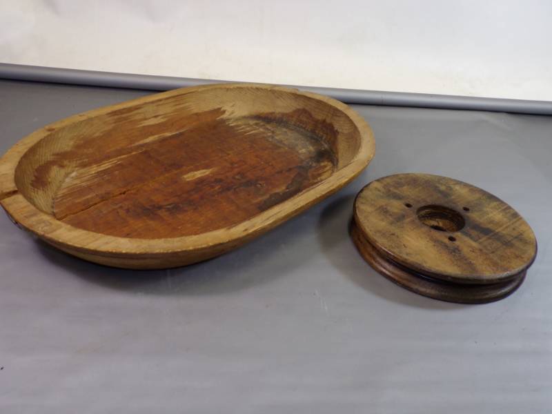 lot 116 image: Primitive hand hewed trencher bowl and wood pulley