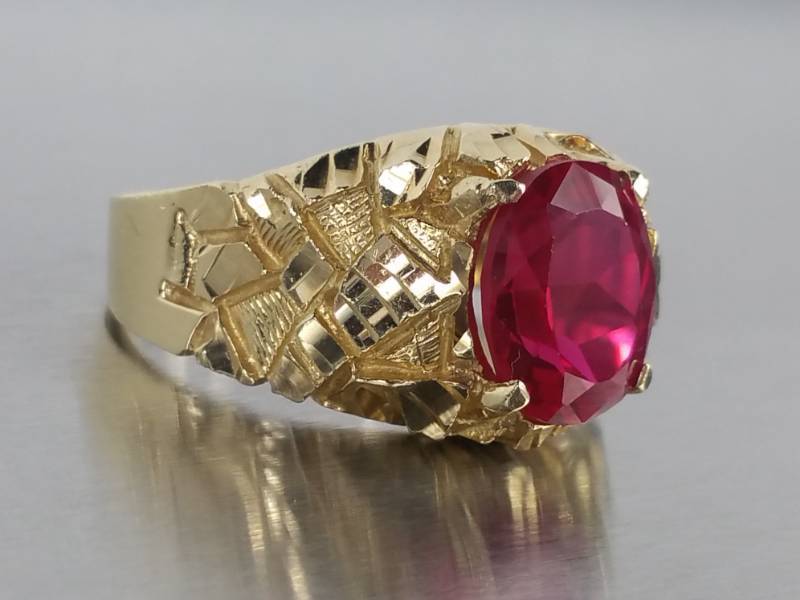 lot 11 image: Bold Ruby and 14k Yellow Gold Nugget Styled Mens Ring