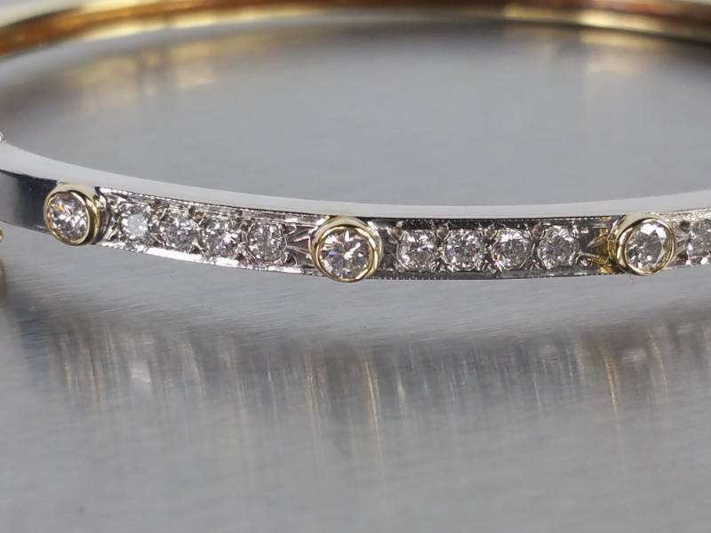 lot 14 image: High-End Two-Tone 14k Diamond Bangle