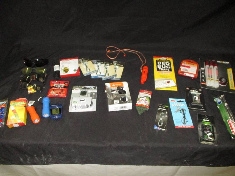 Coleman items, snap hooke, first aid kit , sunglasses, bedbug traps. Cyclecompute, lighters, flashlight  and more