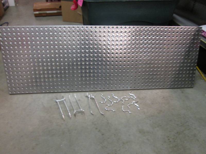 lot 7 image: Metal Diamond Plate Peg Board with ...